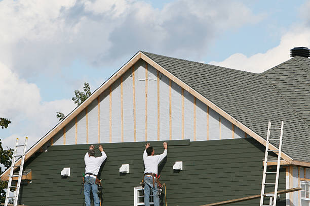 Professional Storm Damage Siding Repair technician working in Colfax, IL